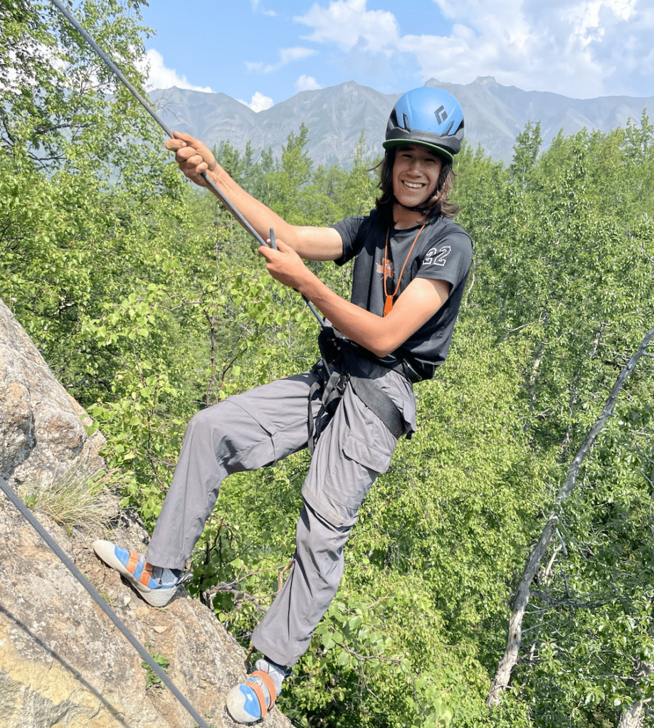 girl showing excitement while hanging with ropes