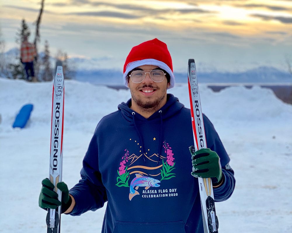 man holding skis