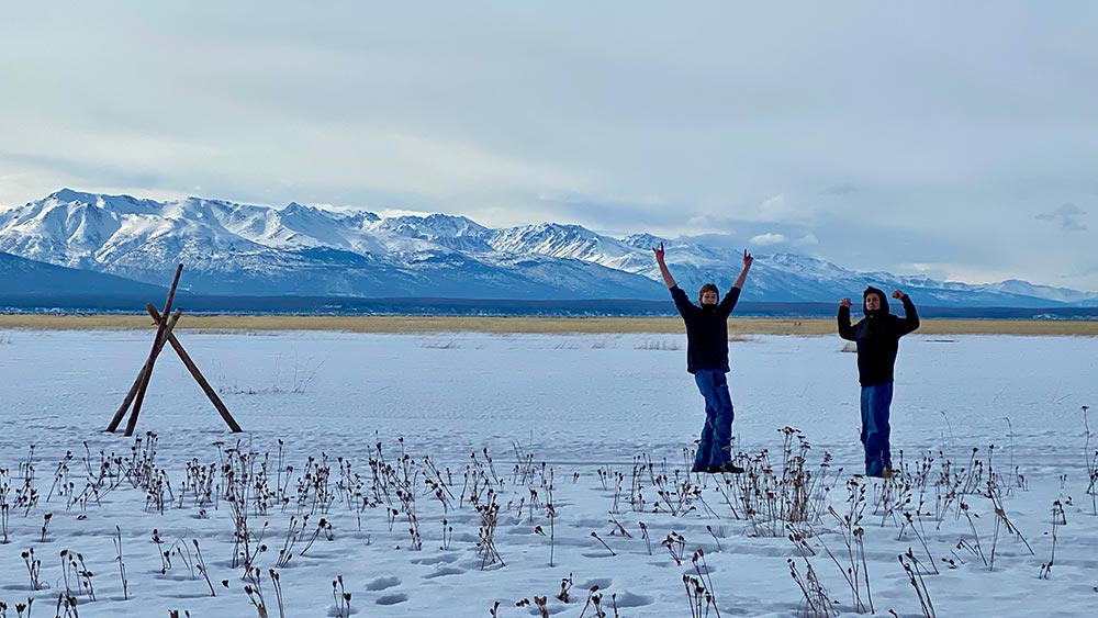 teens on lake in winter