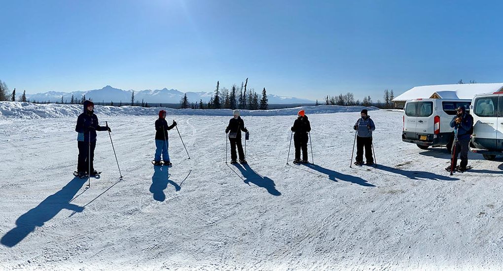 students skiing with onward upward in alaska